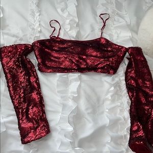 Off the shoulder sequin top with straps.